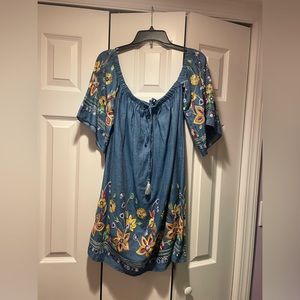 Adorable dress can be worn off shoulders.